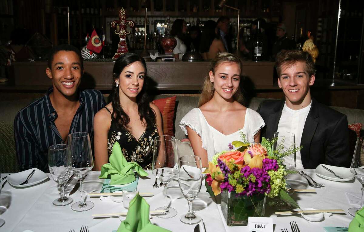 Houston Ballet's dancers Harper Watters, from left, Monica Gomez, Tyler Donatelli and Hayden Stark pose for a photograph at Houston Ballet's "Raising the Barre" dinner at Artisans Restaurant on Sunday, April 29, 2018, in Houston. The four-course dinner was designed by four pairs of young Houston Ballet professionals and famous Houston chefs.