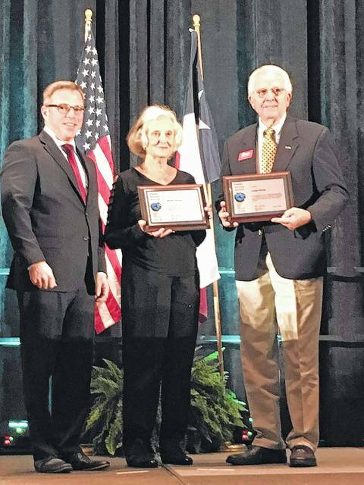 Jack Danielson, executive director of the U.S. Department of Transportation, awards George and Marilyn Murphy in San Antonio, Texas.