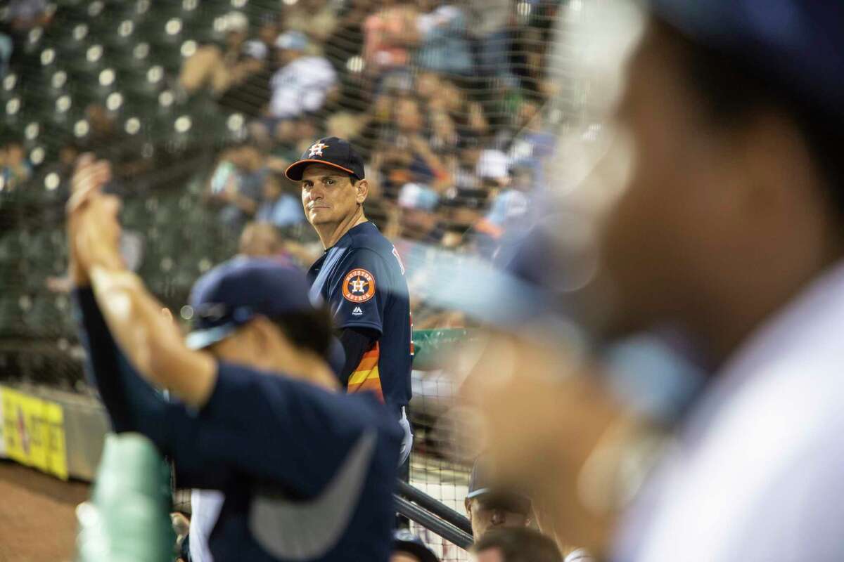 Sig Mejdal, a sabermetrics analyst for the Houston Astros, watches the action from the dugout steps of the team’s Class AA affiliate, the Corpus Christi Hooks, in Corpus Christi, Texas, April 25, 2018. The former NASA engineer who spearheaded the original analytics team commissioned by Astros general manager Jeff Luhnow upon his hire in 2012, is leaving the organization, sources say. (Michael Starghill Jr./The New York Times)