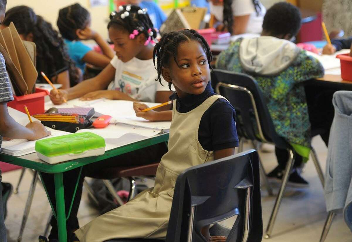 Although they are no longer required by the school's new, more progressive stance, some students still wear uniforms to New Beginnings Family Academy. charter school in Bridgeport, Conn. on Tuesday, September 13, 2016.