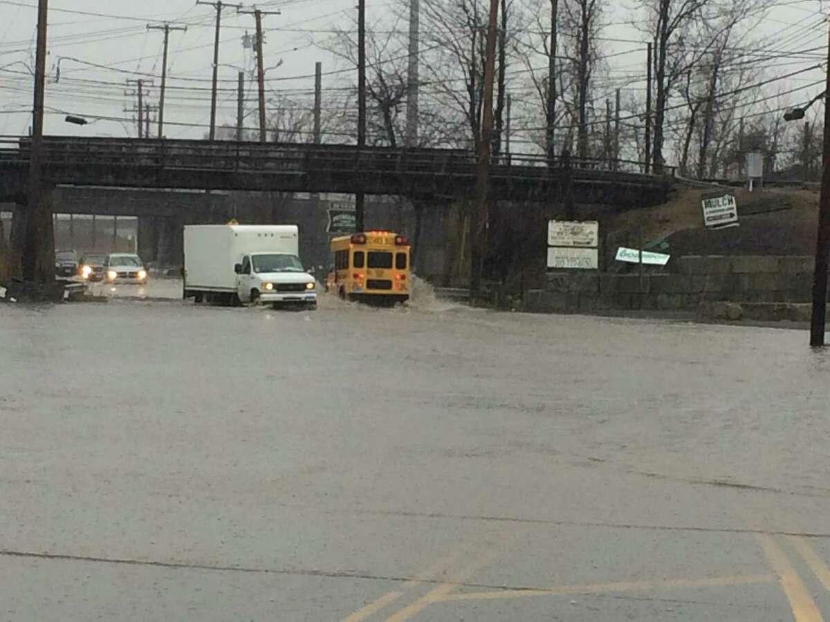 Middletown Avenue/Foxon, New HavenVehicles venture through flooded roadway on Middletown Avenue in New Haven