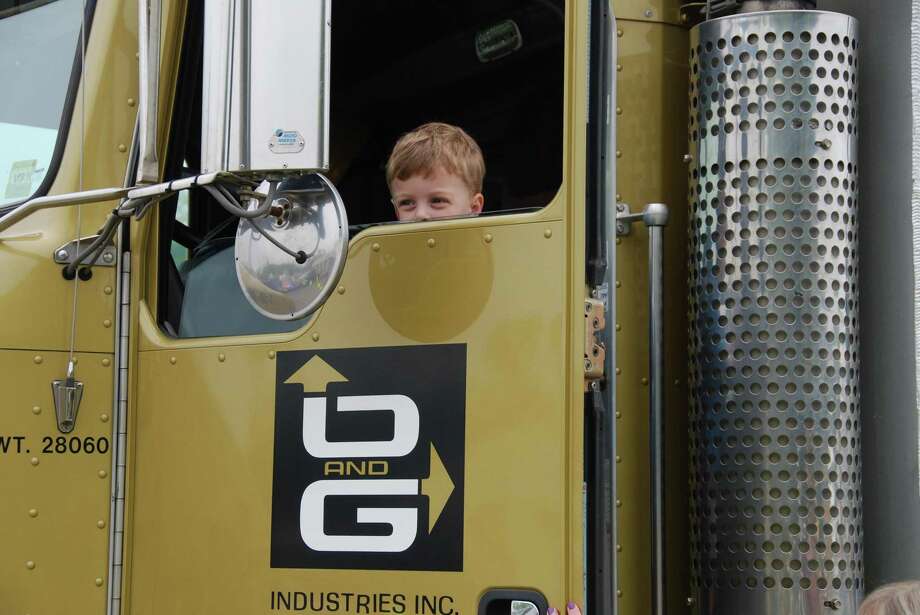 Kids Play Children's Museum is parntering with O& Industries for the annual Touch-A-Truck event on May 12 in Torrington. Above, a child sits inside an O&G truck cab during last year’s event. Photo: Contributed Photo