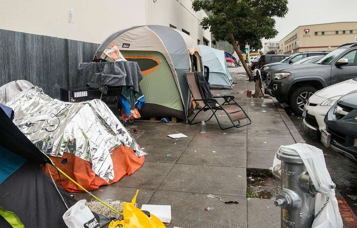 Multiple tents make up a homeless encampment near the corner of Florida and Treat streets Tuesday, March 20, 2018. Despite the attention given from recent sweeps that spurred objections from homeless advocates, sit-lie and improper lodging tickets have both trended down in recent years.