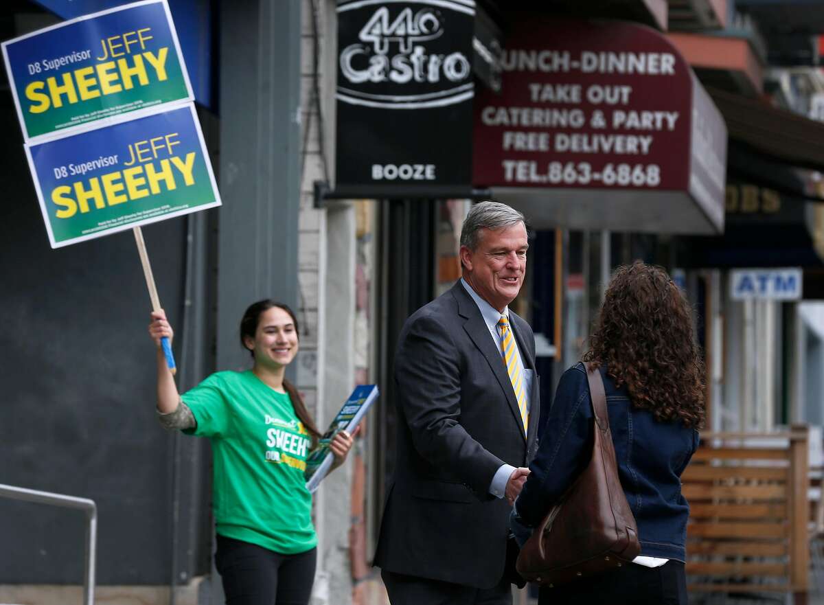Supervisor Jeff Sheehy meets with a voter on Castro Street in San Francisco, Calif. on Wednesday, April 25, 2018 while campaigning with Holly Burke (left) to retain his District 8 seat on the board.