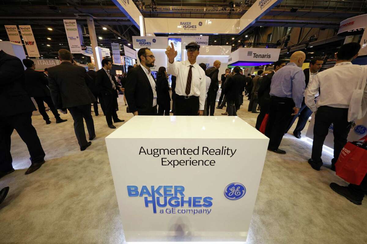 An attendee uses augmented reality glasses at the Baker Hughes, a General Electric (GE) Company, booth during the 2018 Offshore Technology Conference (OTC) in Houston, Texas, U.S., on Monday, April 30, 2018. The OTC gathers energy professionals to exchange ideas and opinions to advance scientific and technical knowledge for offshore resources. Photographer: Aaron M. Sprecher/Bloomberg