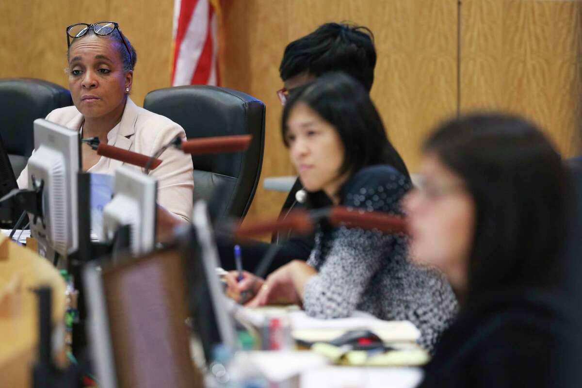 In this April file photo, Houston ISD Board of Education President Rhonda Skillern-Jones, left, listens during an agenda review meeting. Trustees unanimously approved the district's $2 billion 2018-2019 budget Monday.