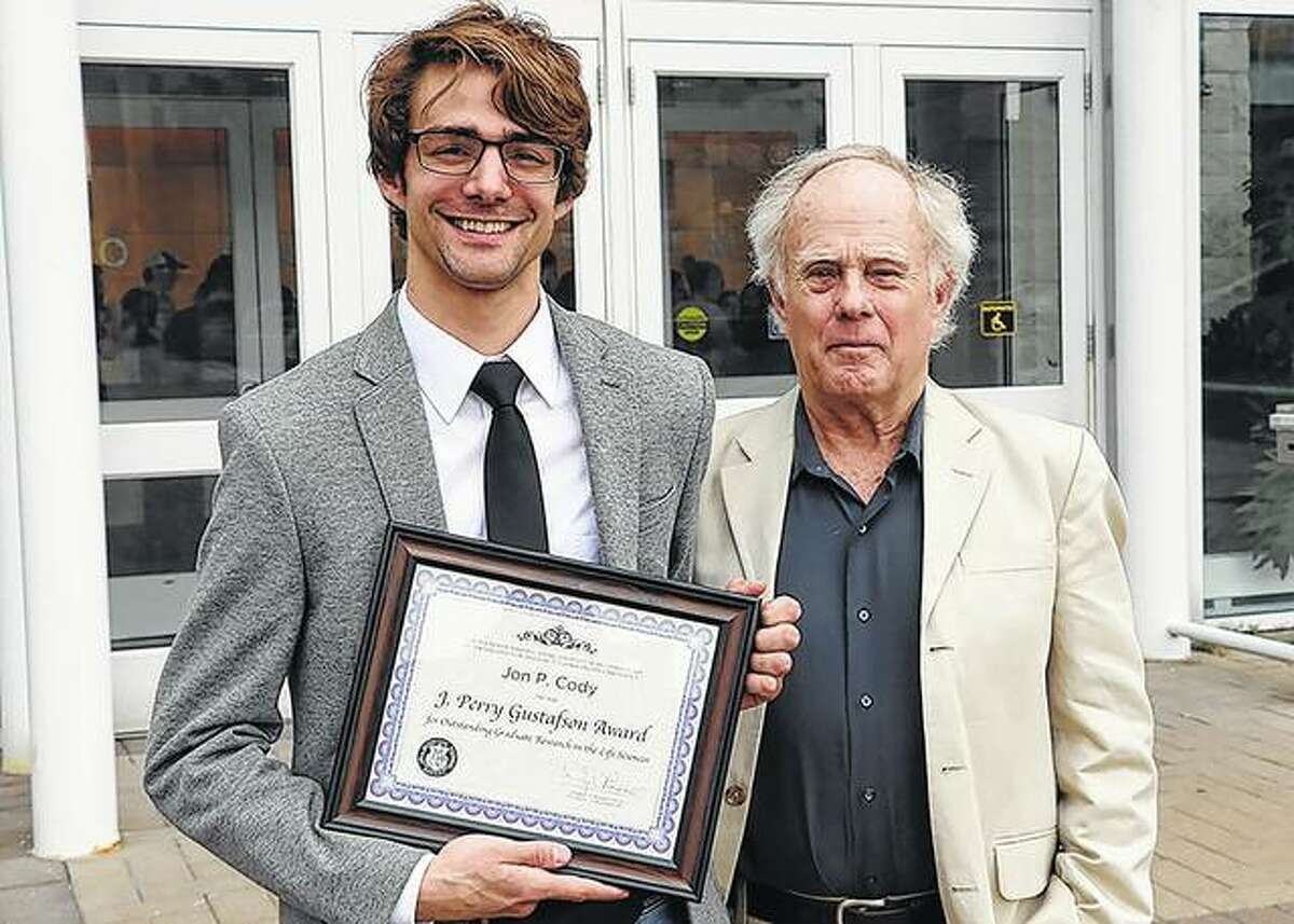 Graduate student Jon Cody (left) earned the J. Perry Gustafson Award for Outstanding Graduate Research in the Life Sciences this year at the University of Missouri. Gustafson is at right.