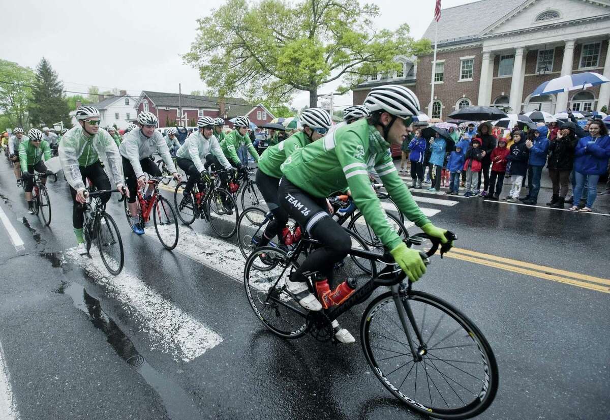 Team 26 cyclists at Edmond Town Hall in Newtown as they return from Washington DC. Sunday, May 7, 2017