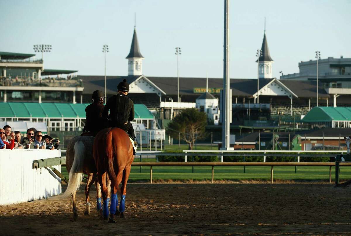 LOUISVILLE, KY - MAY 01: Justify walks to the track during the morning training for the Kentucky Derby at Churchill Downs on May 1, 2018 in Louisville, Kentucky.