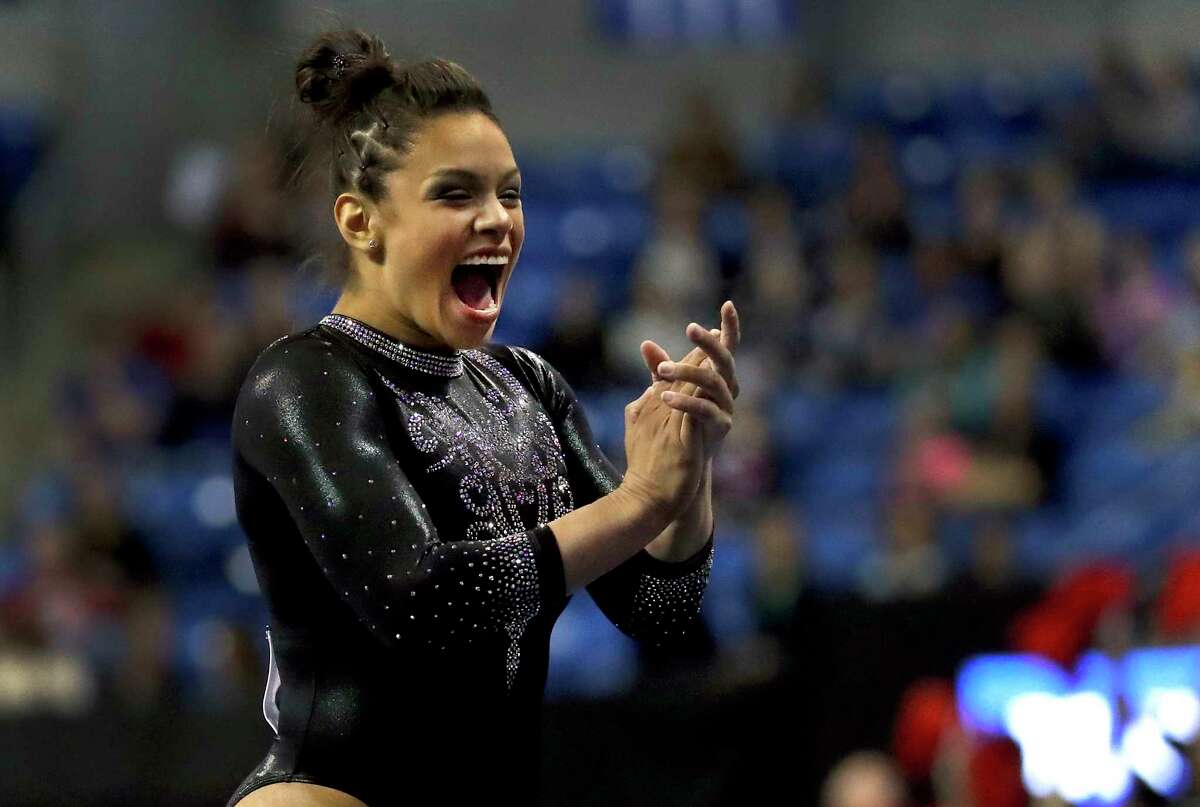 Georgia's Sabrina Vega applauds after competing in the floor exercise during the NCAA college women's gymnastics championships Friday, April 20, 2018, in St. Louis. (AP Photo/Jeff Roberson)
