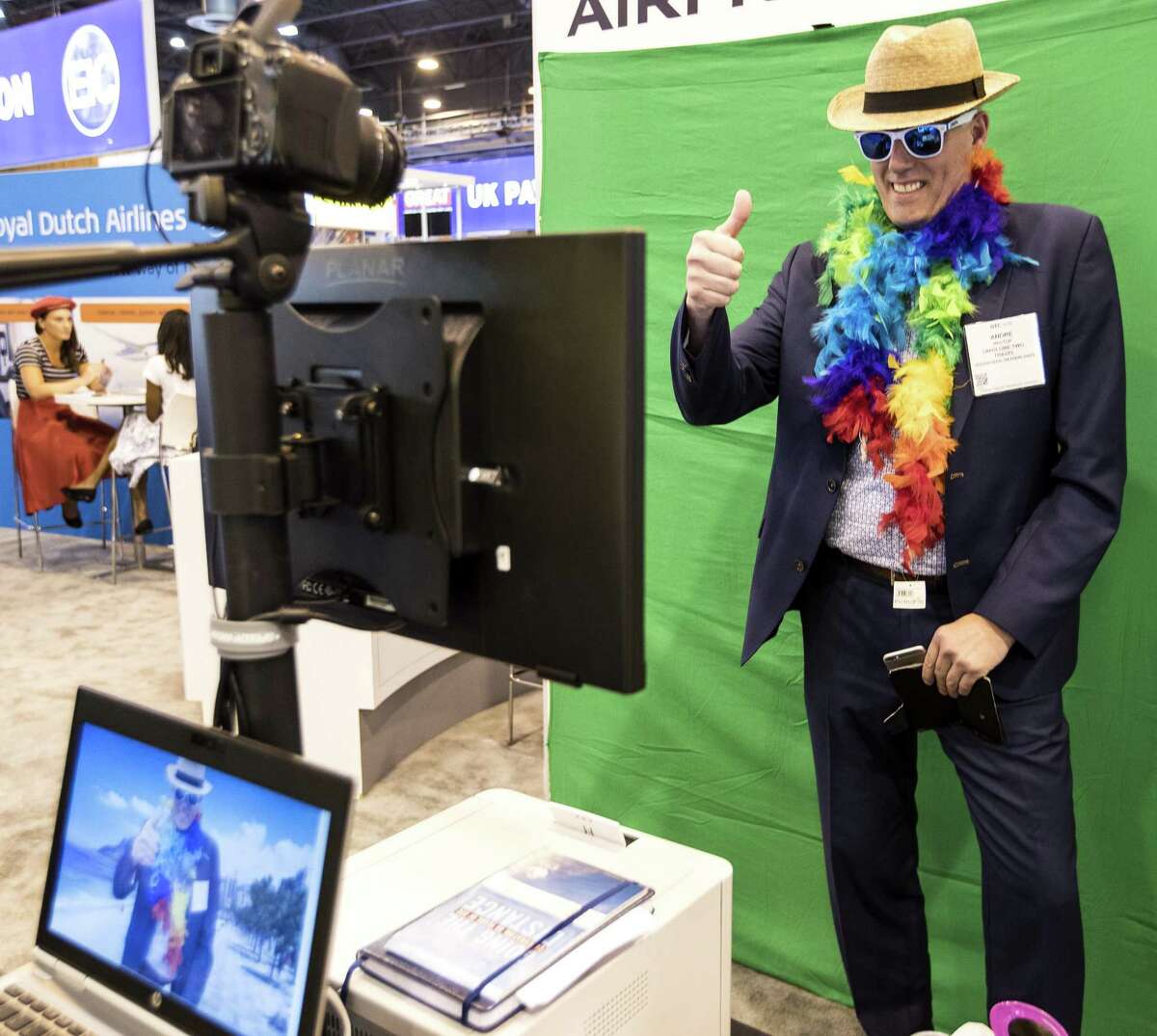 Andre Regtop, of The Netherlands, poses for a funny green screen photo during the 50th Offshore Technology Conference on Monday, April 30, 2018, in Houston. ( Brett Coomer / Houston Chronicle )