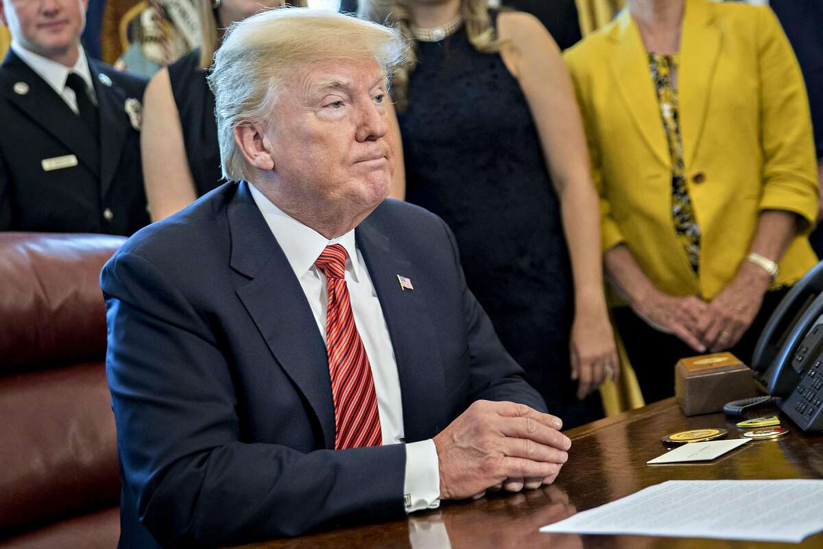 U.S. President Donald Trump listens while meeting with the crew and passengers of Southwest Airlines Co. flight 1380 in the Oval Office of the White House in Washington, D.C., U.S., on Tuesday, May 1, 2018. An engine on Southwest's flight 1380, a Boeing Co. 737-700 bound for Dallas from New Yorks LaGuardia airport, exploded and made an emergency landing on April 17 sending shrapnel into the plane and killing a passenger seated near a window. Photographer: Andrew Harrer/Bloomberg