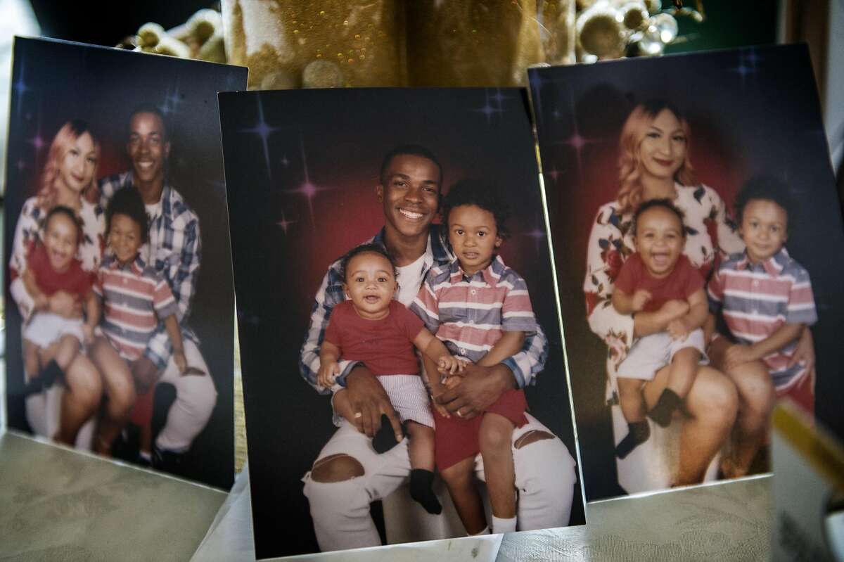 Pictures showing Stephon Clark and his wife Salena Manni, and sons Aiden Clark, 3, and Cairo Clark, 1, rested on a table inside his grandmother Sequita Thompson's home in Sacramento, Calif., on Tues., March 20, 2018. (Renee C. Byer/Sacramento Bee/TNS)