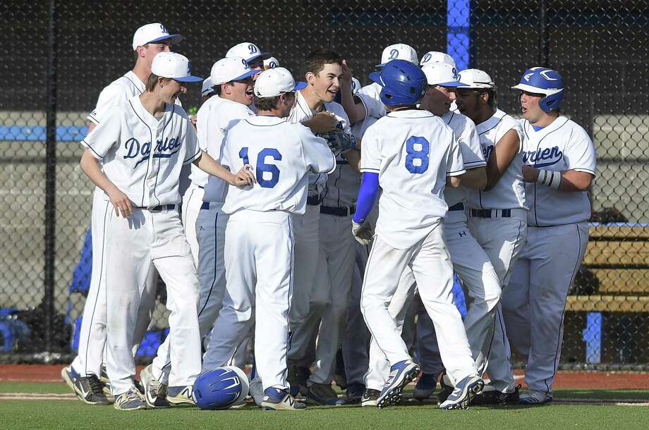 darien justin jordan (8) and henry williams (11) are mobbed by