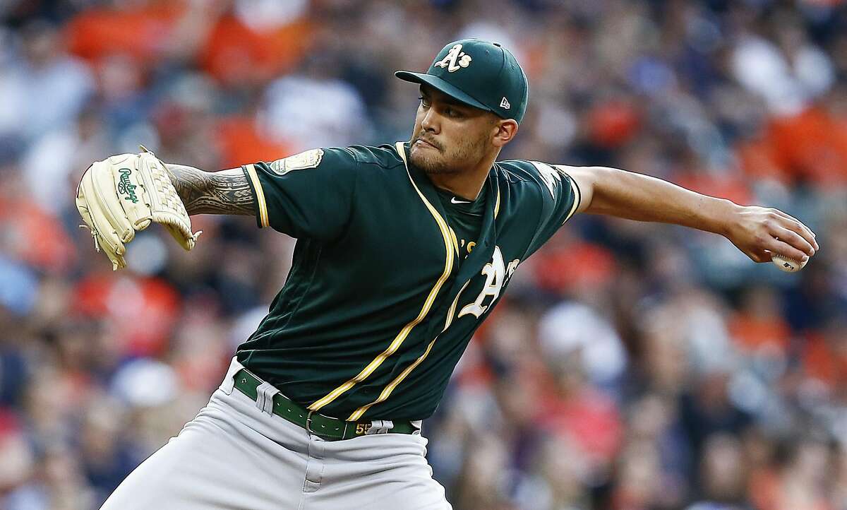 HOUSTON, TX - APRIL 27: Sean Manaea #55 of the Oakland Athletics pitches in the first inning against the Houston Astros at Minute Maid Park on April 27, 2018 in Houston, Texas. (Photo by Bob Levey/Getty Images)