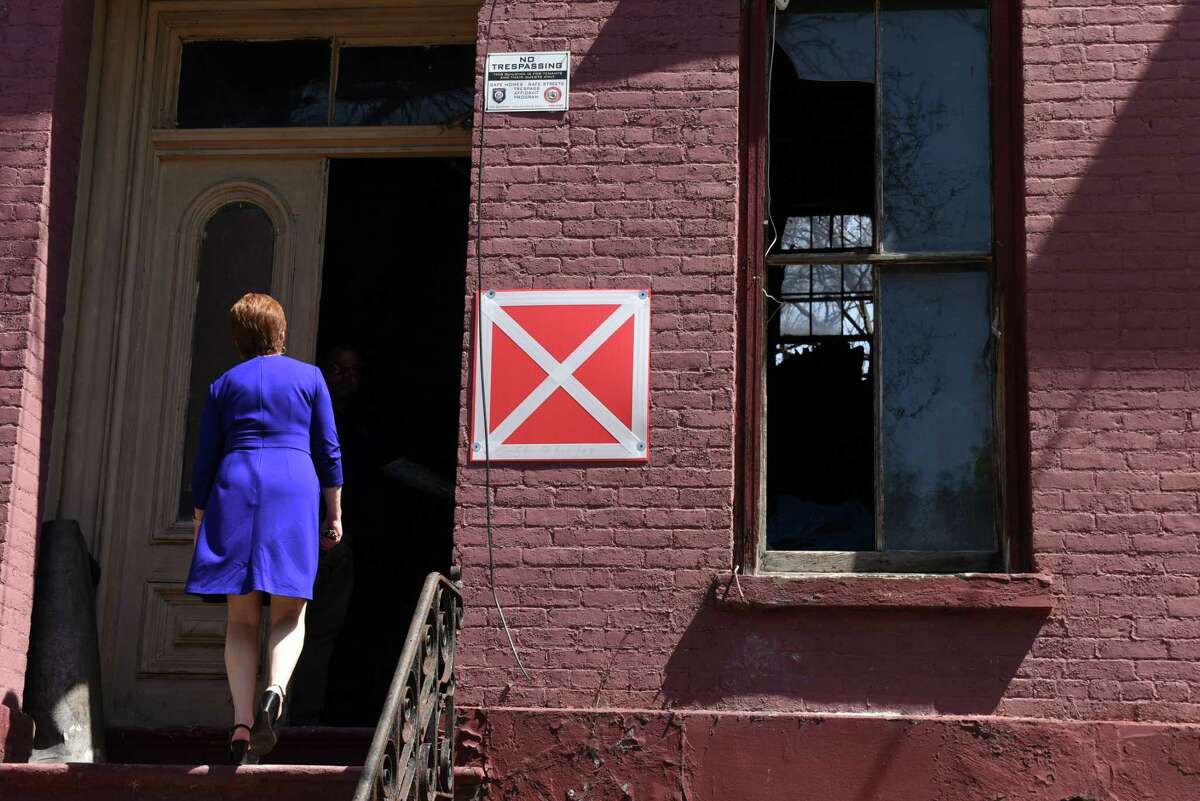 Mayor Kathy Sheehan takes a look inside 19 Second St. on Wednesday, May 2, 2018, in Albany, N.Y. Albany city officials worked to stabilize the vacant building after receiving a 911 all about the front door being unsecure. When engineers arrived, the found the interior floors collapsed and the back wall bowing out. (Will Waldron/Times Union)
