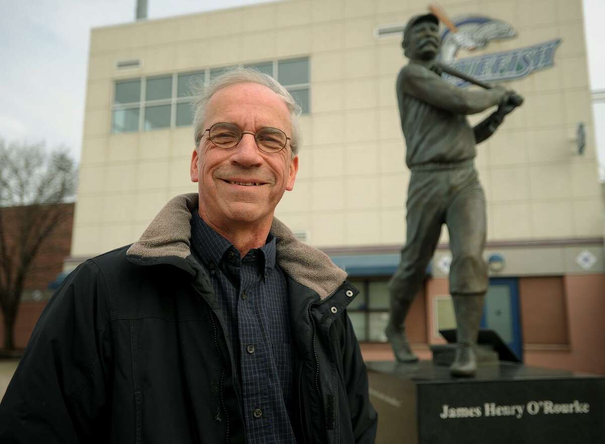 Author William Ryczek, of Wallingford, outside Harbor Yard Ballpark and the statue of early baseball great James O'Rourke in Bridgeport, Conn. on Wednesday, March 28, 2017. Ryczek recently authored his eighth book, Baseball on the Brink: The Crisis of 1968.