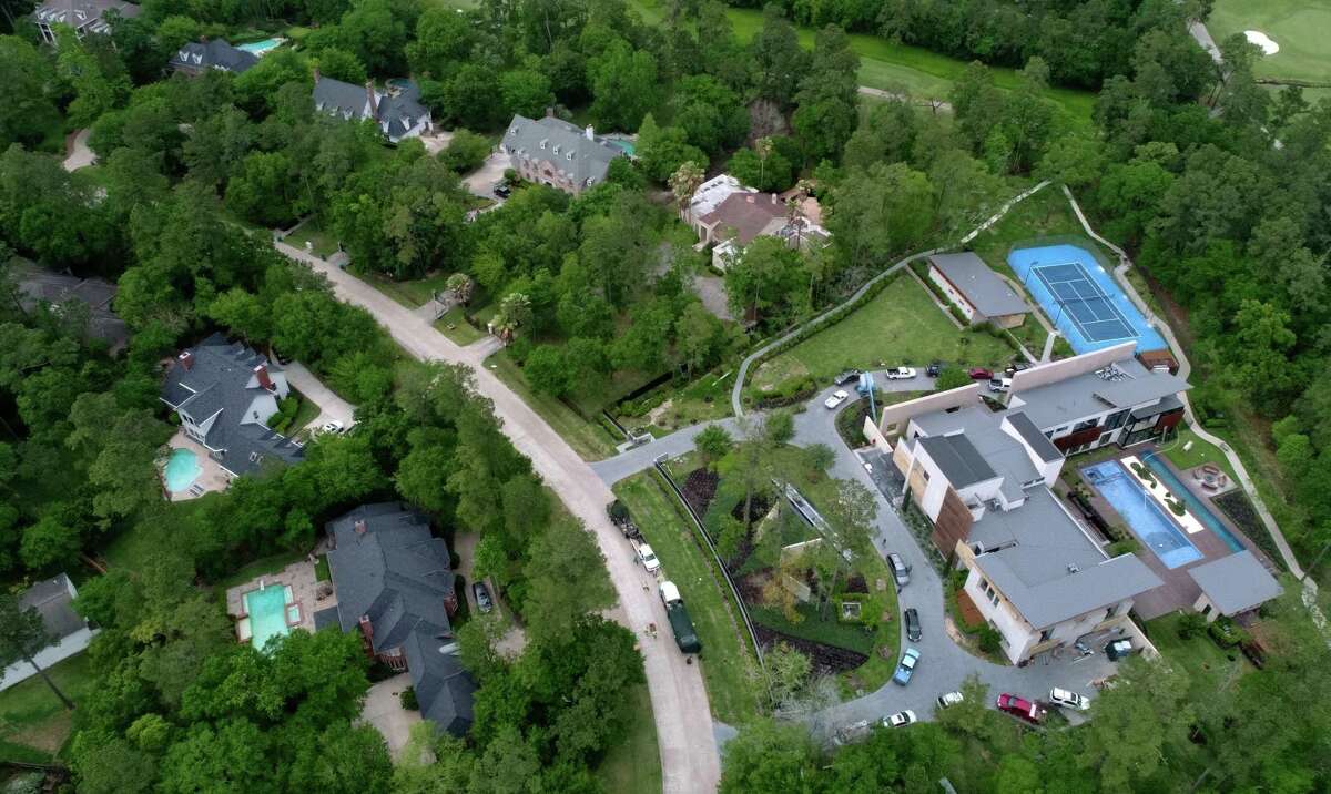 Drone photograph of the 18,000 -square-foot house in The Woodlands Thursday, April 5, 2018, in Spring, Texas. Neighbors have complained about the traffic and the trucks parked on the street. The owners have consistently failed to get township approval for the changes made to the home's exterior
