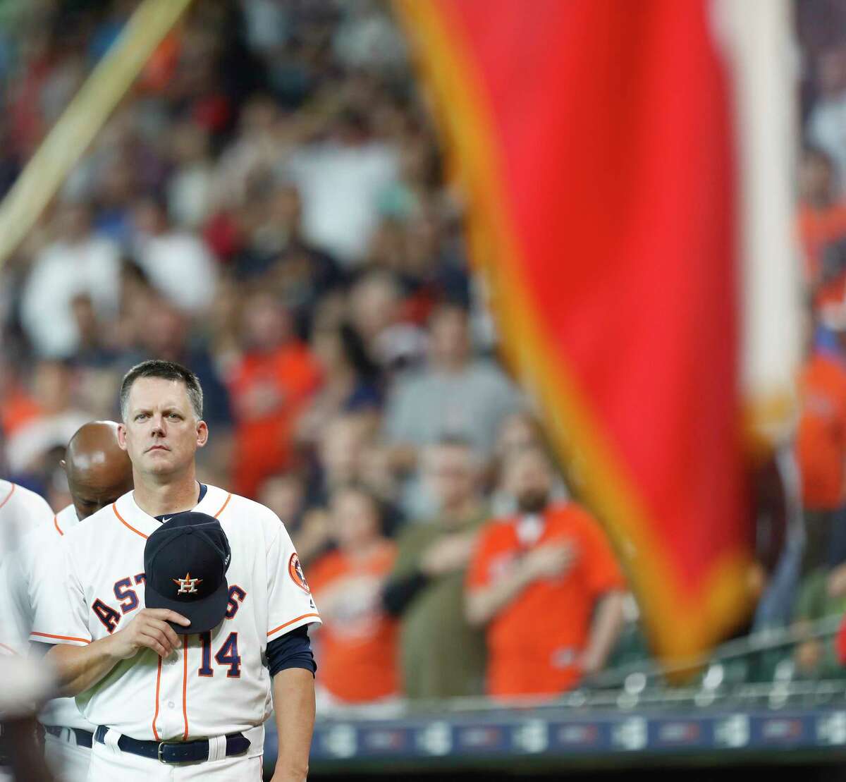 Houston Astros manager AJ Hinch (14) during the National Anthem before the start of the first inning of an MLB game at Minute Maid Park, Thursday, May 3, 2018, in Houston.