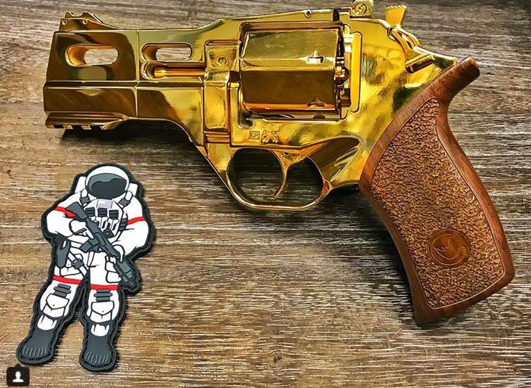 Houston gun designer creates a Rockets-themed pistol for rapper Paul Wall