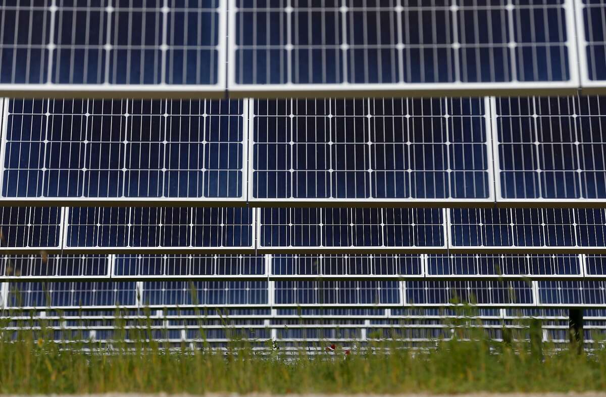 A solar panel array collects energy from the sun on land leased at the Chevron refinery in Richmond, Calif. on Wednesday, April 18, 2018. The MCE Solar One site, a joint project of Marin Clean Energy and sPower, contains nearly 36,000 solar panels on a 60-acre site which can generate renewal energy for up to 3,900 customers annually.