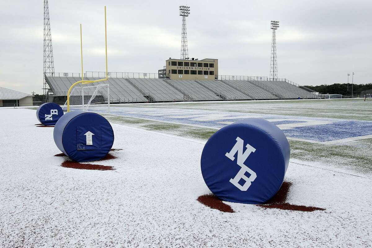 Unicorn Stadium in New Braunfels is coated with white as sleet falls in the Hill Country on February 6, 2014.