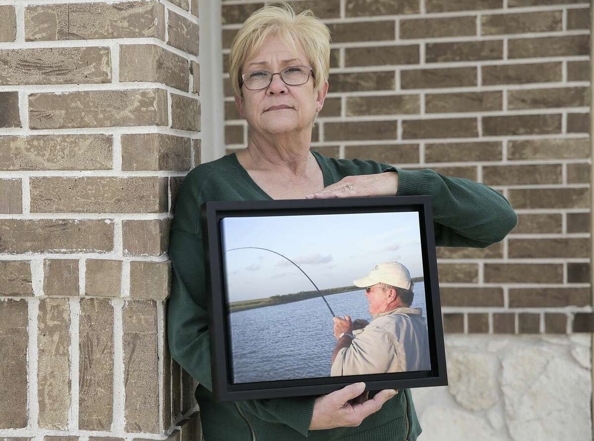 Judy Kveton holds a photo of her husband, David. He died of complications from a heart transplant at Baylor St. Luke's Medical Center.