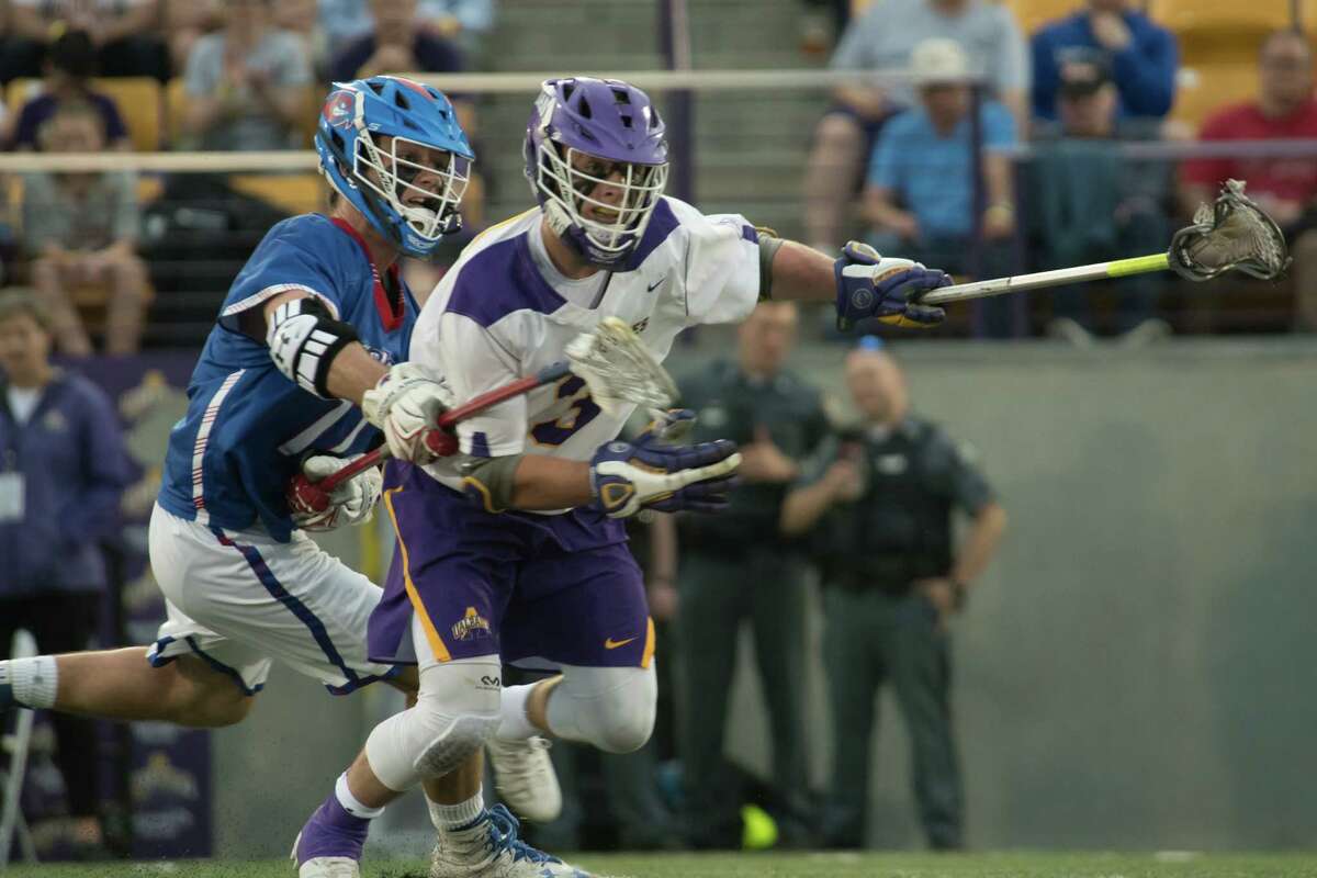 UMass Lowell defenseman Will Puduski stick checks UAlbany face-off specialist TD Ierlan following a face-off during the America East semifinal in Albany, N.Y., on Thursday, May 3, 2018. (Jenn March, Special to the Times Union)
