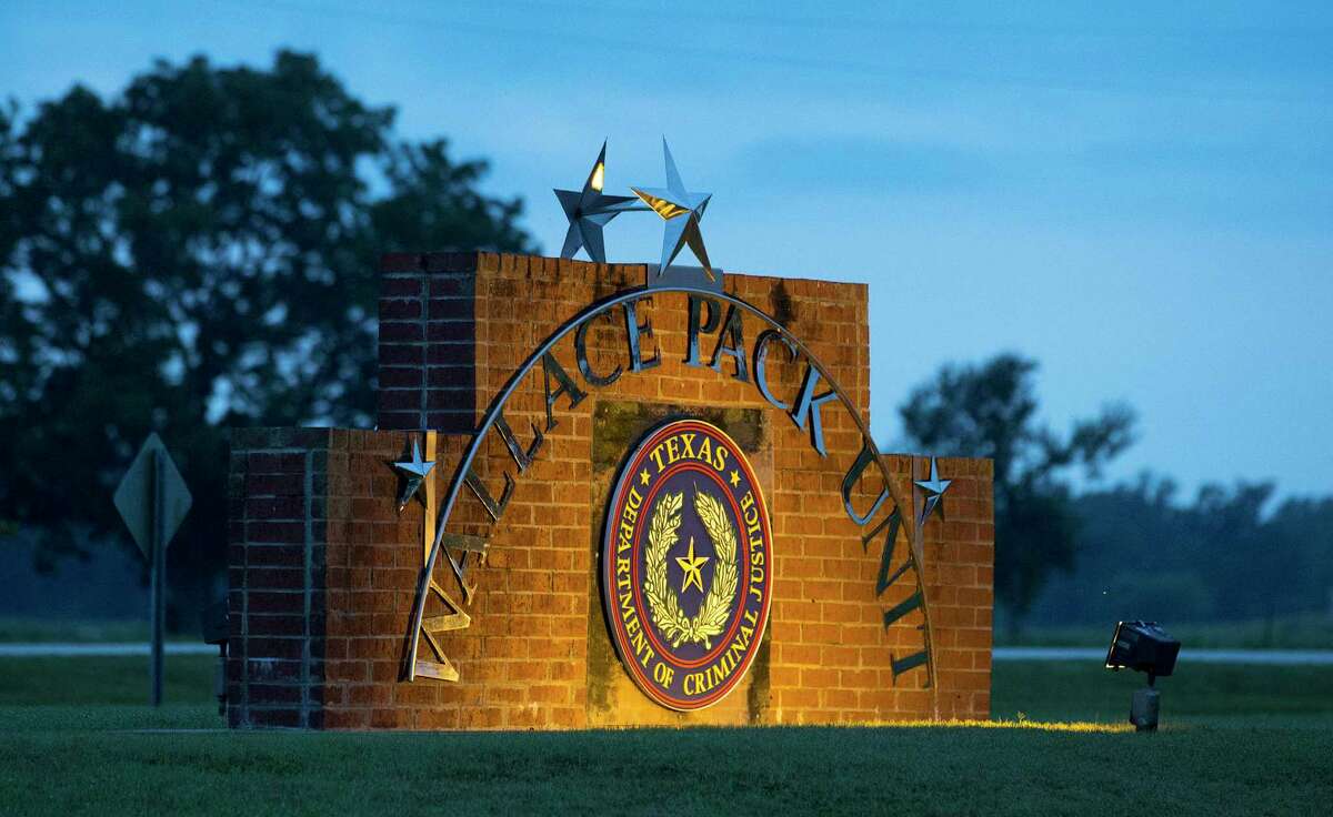 The sign of the Wallace Pack Unit is seen at dawn on Wednesday, Aug. 9, 2017, in Navasota. ( Yi-Chin Lee / Houston Chronicle )