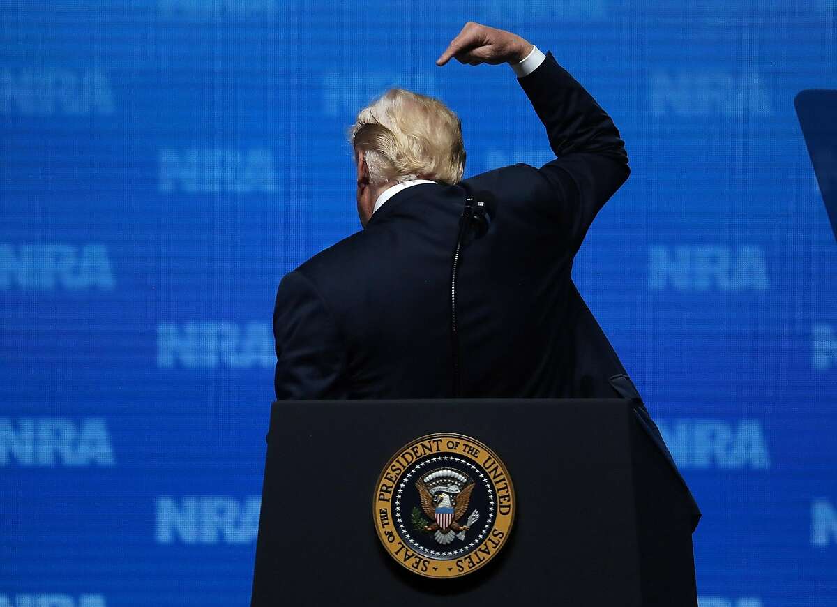 DALLAS, TX - MAY 04: U.S. President Donald Trump gestures as he speaks at the NRA-ILA Leadership Forum during the NRA Annual Meeting & Exhibits at the Kay Bailey Hutchison Convention Center on May 4, 2018 in Dallas, Texas. The National Rifle Association's annual meeting and exhibit runs through Sunday. (Photo by Justin Sullivan/Getty Images)