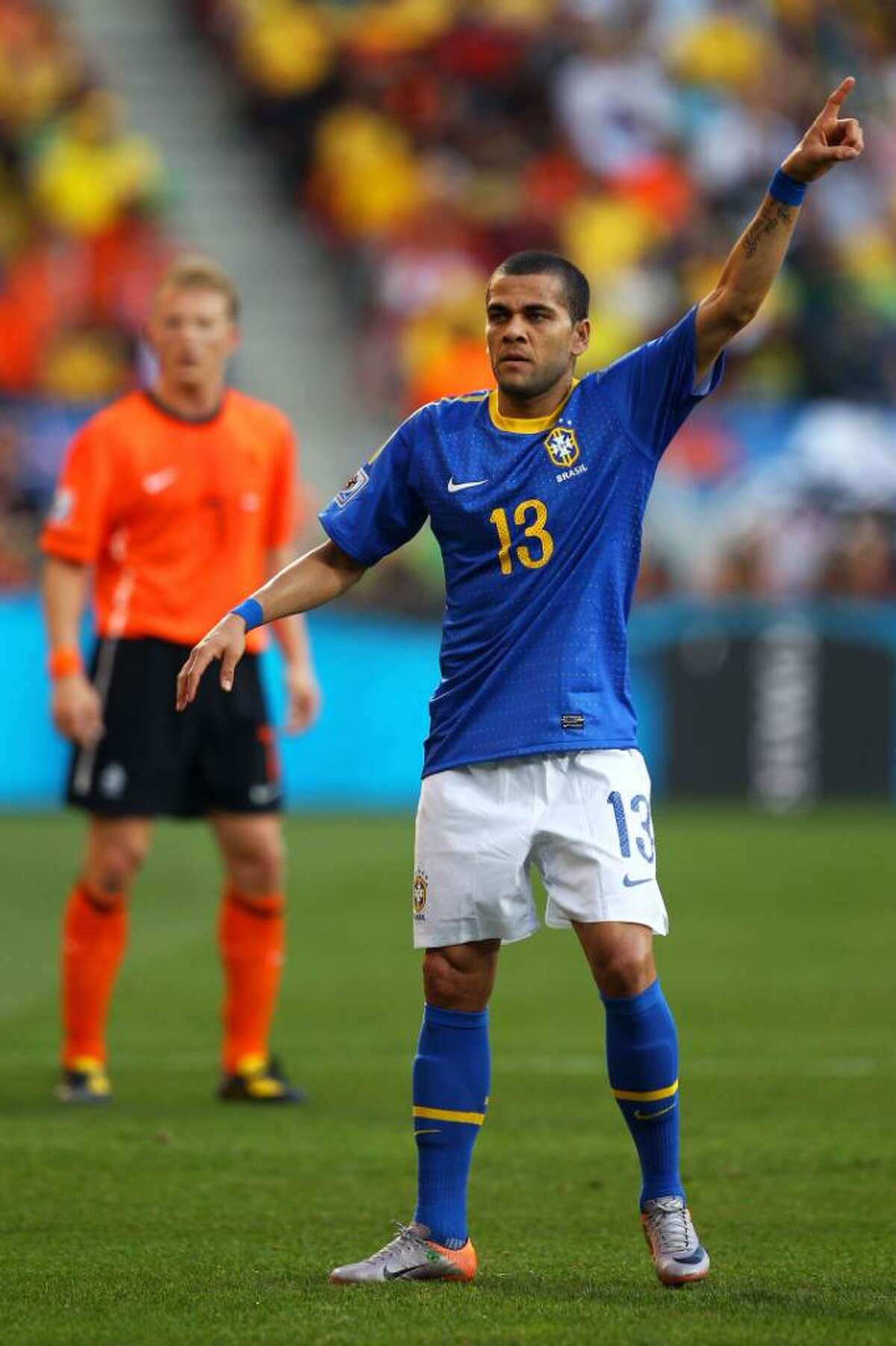 PORT ELIZABETH, SOUTH AFRICA - JULY 02: Dani Alves of Brazil gestures during the 2010 FIFA World Cup South Africa Quarter Final match between Netherlands and Brazil at Nelson Mandela Bay Stadium on July 2, 2010 in Nelson Mandela Bay/Port Elizabeth, South Africa. (Photo by Richard Heathcote/Getty Images) *** Local Caption *** Dani Alves