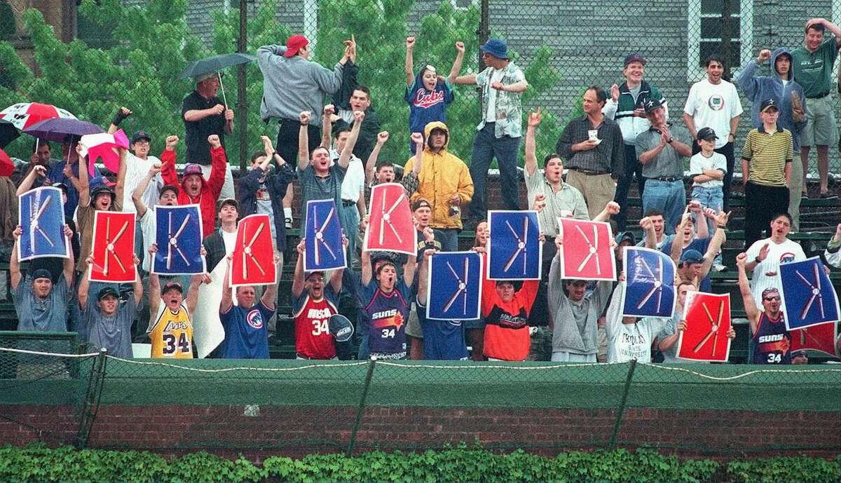 The Cubs' Kerry Wood kept fans in the Wrigley Field bleachers busy flashing 'K' signs as he tied the MLB record for strikeouts in a nine-inning game with 20 against the Astros on May 6, 1998.