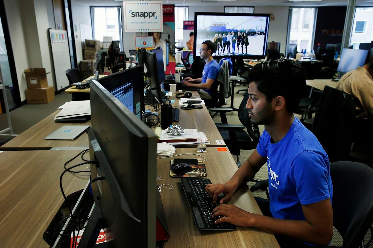 From front: Snappr growth and operations manager Rafat Khan and co-founder Matt Schiller work from their desk, Thursday, May 3, 2018, in San Francisco, Calif.