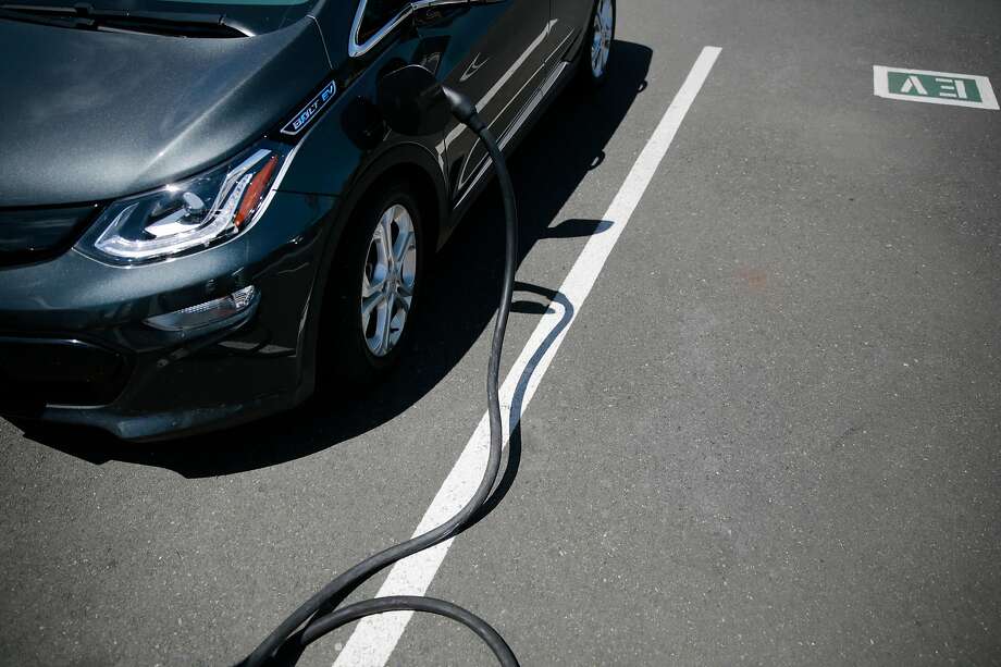 A Chevy Bolt all-electric vehicle charges at a dealership in Santa Rosa, which saw a huge jump in sales of plug-in vehicles, along with a rise in demand for cars after the wildfires last fall. Photo: Ramin Rahimian / Special To The Chronicle