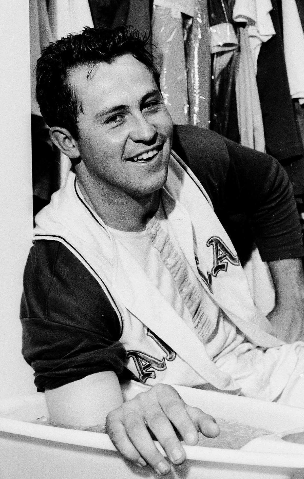 FILE--Jim 'Catfish' Hunter is all smiles as he soaks his pitching arm in ice water and talks with reporters after pitching a perfect game against the Minnesota Twins, in this May 8, 1968 in Oakland, Calif. Thirty-one years ago today, Hunter pitched a perfect game _ one of just 13 perfect games in Major League baseball history. Surrounded by former teammates and hometown family and friends, Hunter marked another milestone, the first fundraiser to aid those, like him, diagnosed with Lou Gehrig's disease.(AP Photo/FILE)