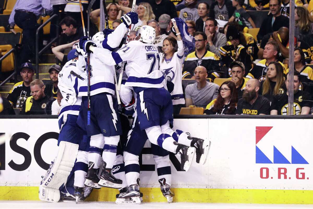 BOSTON, MA - MAY 4: Teammates swarm Dan Girardi #5 of the Tampa Bay Lightning after he scored the game winning goal during overtime of Game Four of the Eastern Conference Second Round during the 2018 NHL Stanley Cup Playoffs at TD Garden on May 4, 2018 in Boston, Massachusetts. The Lightning defeat the Bruins 4-3. (Photo by Maddie Meyer/Getty Images)