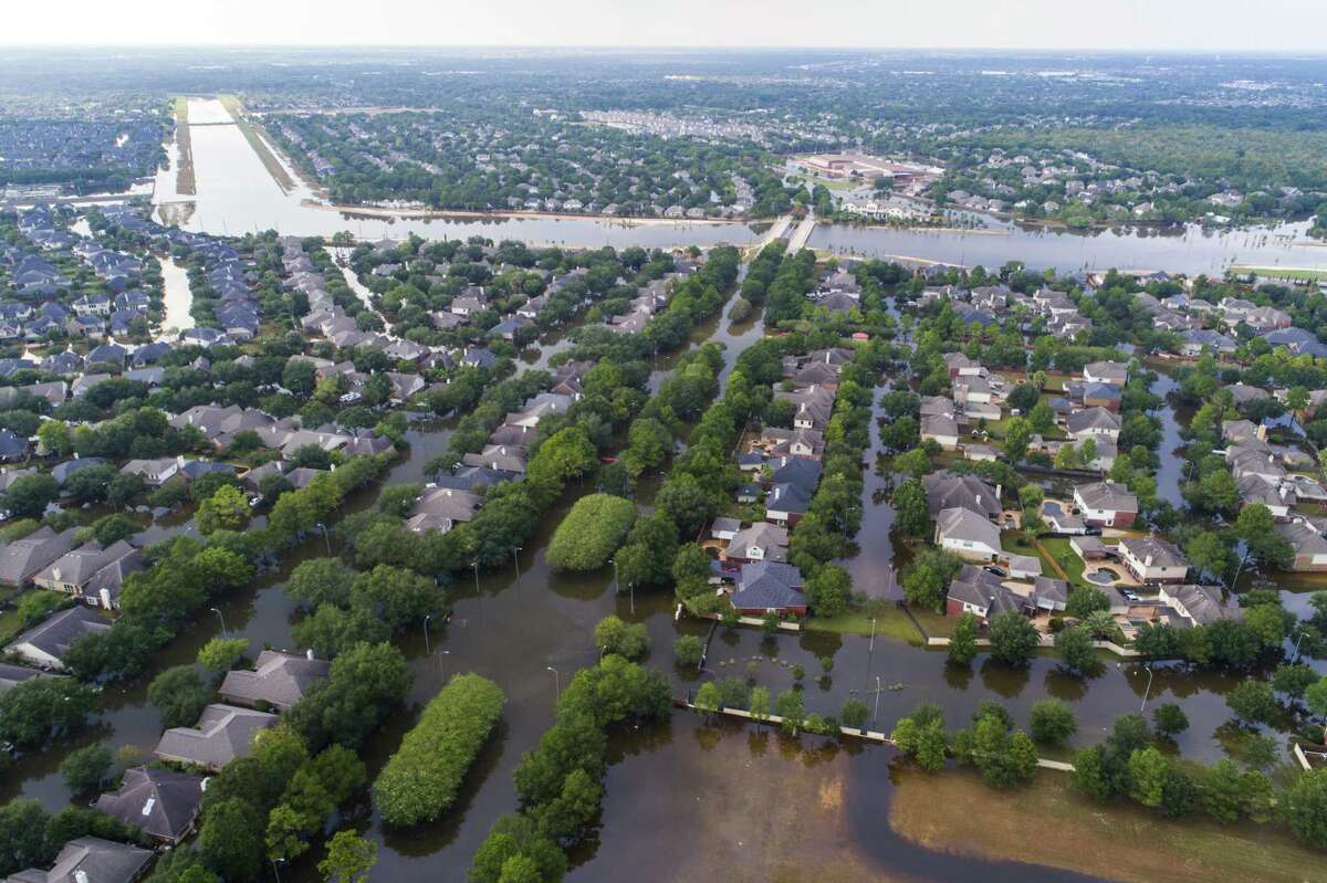 Homes in the Cinco Ranch area are surrounded by water from Barker Reservoir, Saturday, September 2, 2017, in Houston. (Mark Mulligan / Houston Chronicle)