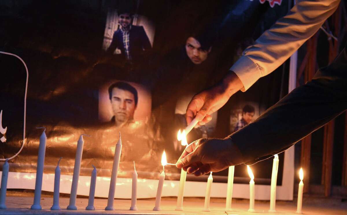 Pakistani journalists light candles during a vigil for Afghan journalists killed in a targeted suicide bombing, to mark World Press Freedom Day in Quetta on May 3, 2018. Ten journalists were killed April 30, including Agence France-Presse chief photographer Shah Marai, in attacks in Kabul that sparked outrage around the world and underscored the dangers faced by Afghan media.