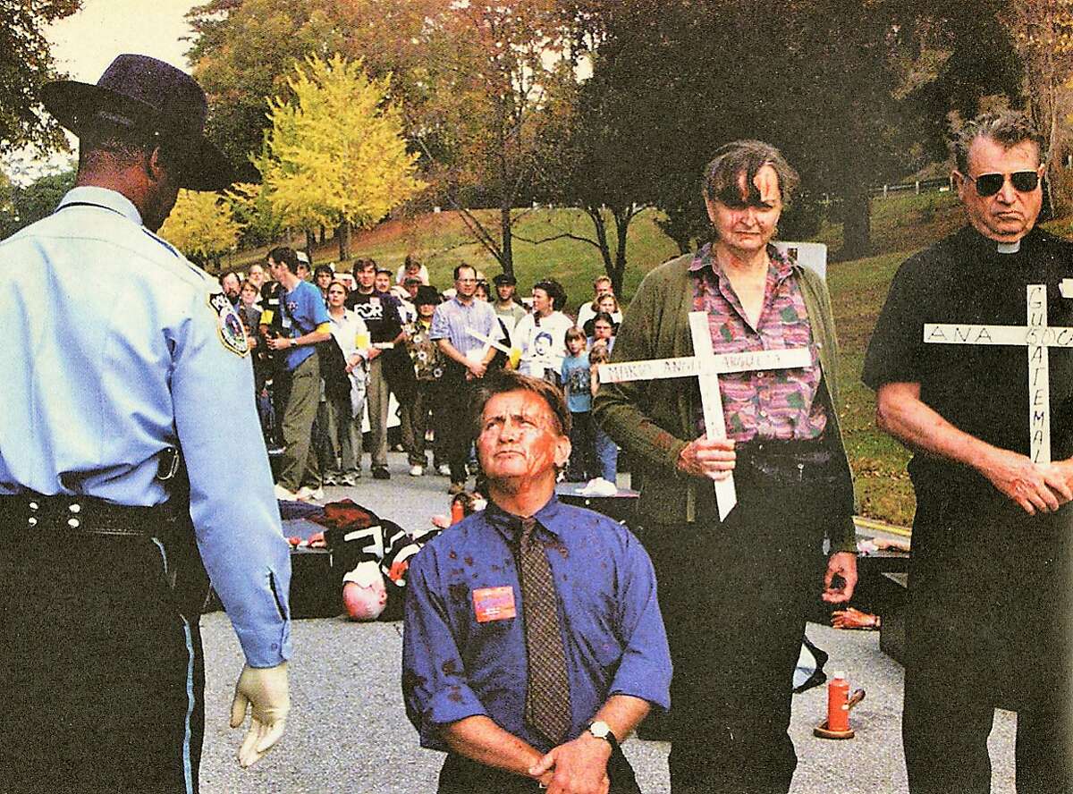 Martin Sheen, Davida Coady, and Father Bill O�Donnell protesting in 2001 at the former School of the Americas at Fort Benning, Ga.