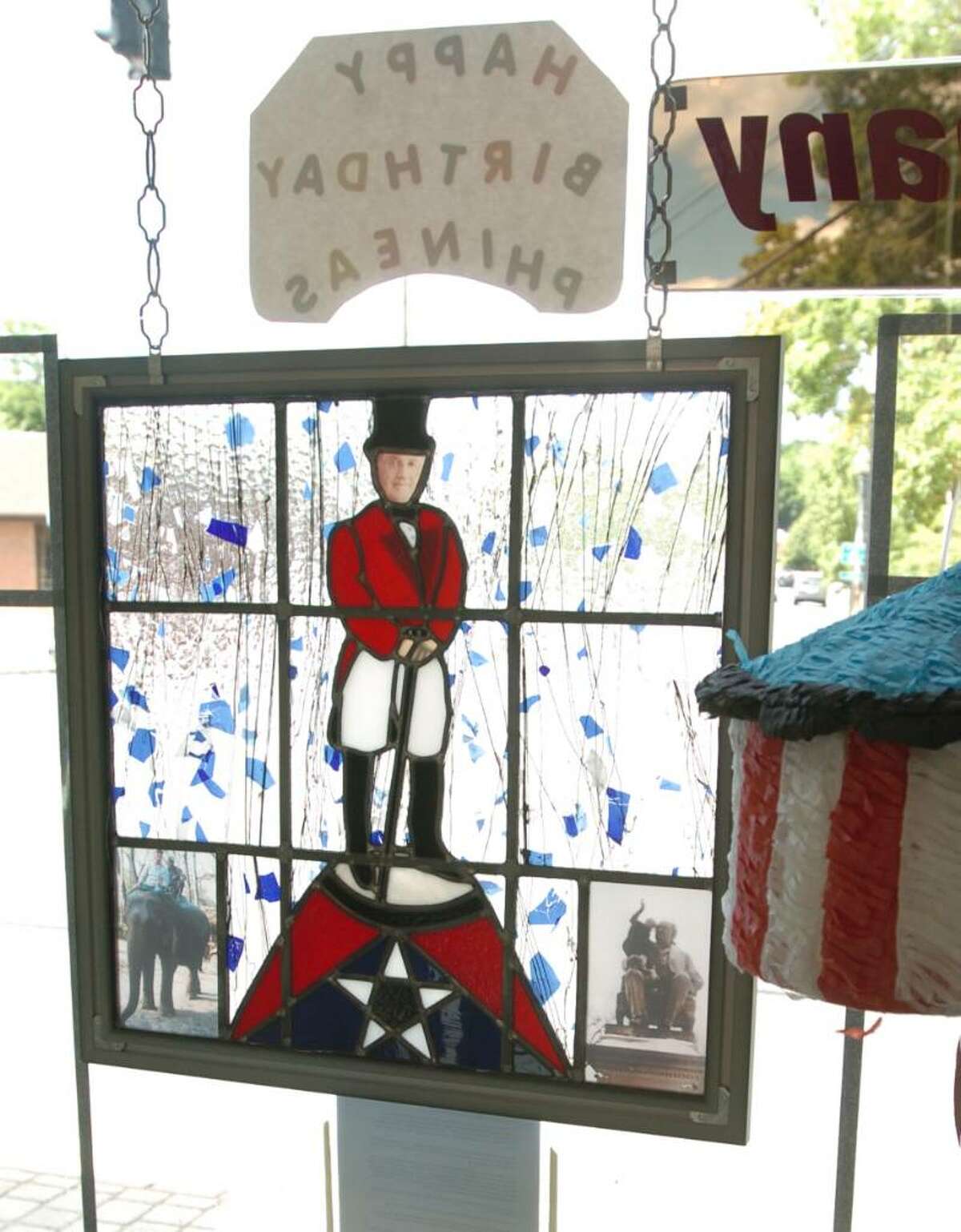 A glass mural of P.T. Barnum created by Bethel artist Will Turey hangs in Bethel Glass and Shower Door store July 1, 2010.