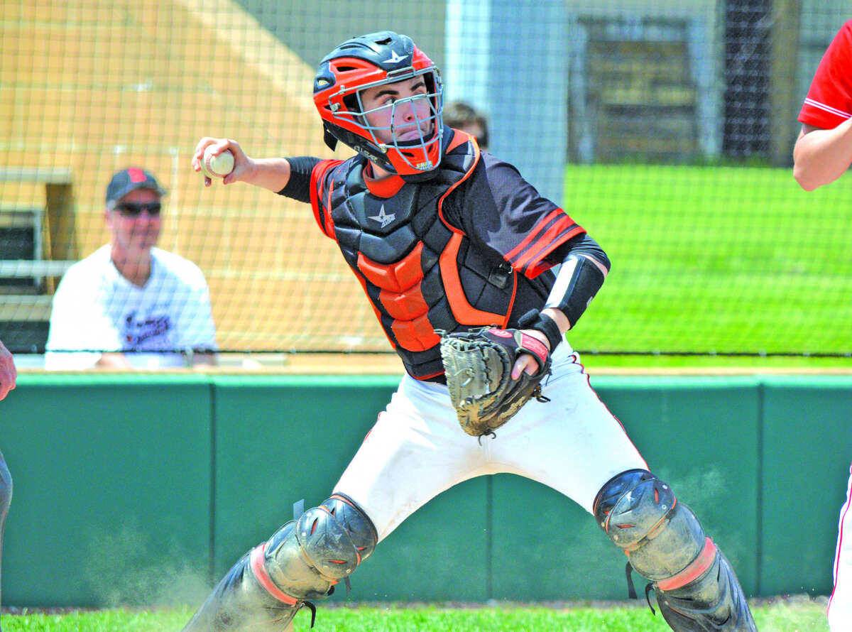Edwardsville junior catcher Dalton Wallace makes a throw on an attempted steal of second during the third inning of Saturday’s game against Chatham Glenwood.