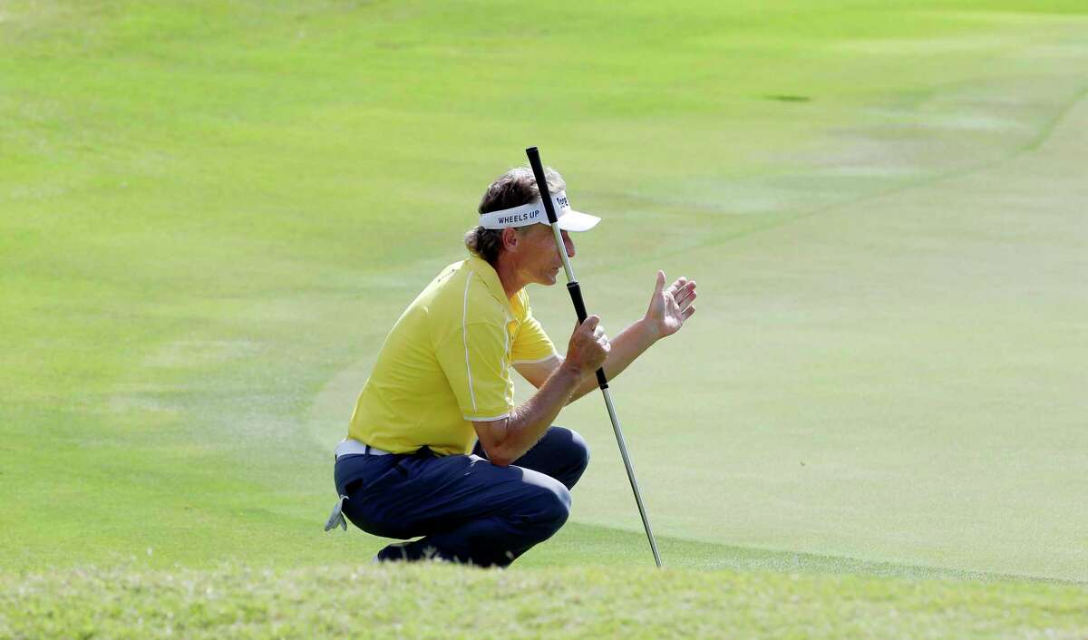 Leader Bernhard Langer uses his hands as he studies the 18th green before putting during the second round of the Insperity Invitational at the The Woodlands Country Club Saturday, May 5, 2018, in The Woodlands, TX. (Michael Wyke / For the Chronicle)