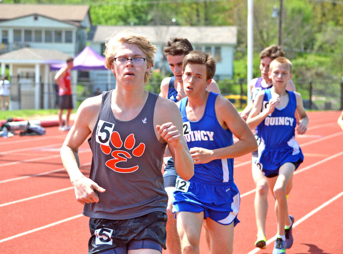 Edwardsville sophomore Henry Gruben, left, competes in the 3,200-meter run on Saturday at the Collinsville Invitational.
