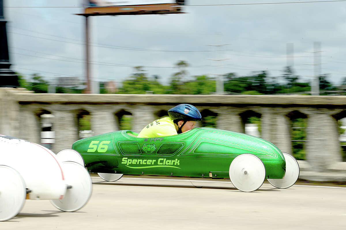 Competitors race down the Maury Meyer Bridge as they vie for the win at the finish in the annual Southeast Texas All-American Soap Box Derby races. The finals will be held Sunday, with winners earning a spot for the national competition in Akron, OH. Photo taken Saturday, May 5, 2018 Kim Brent/The Enterprise