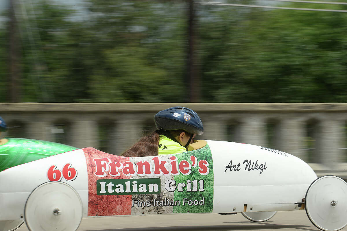 Competitors race down the Maury Meyer Bridge as they vie for the win at the finish in the annual Southeast Texas All-American Soap Box Derby races. The finals will be held Sunday, with winners earning a spot for the national competition in Akron, OH. Photo taken Saturday, May 5, 2018 Kim Brent/The Enterprise