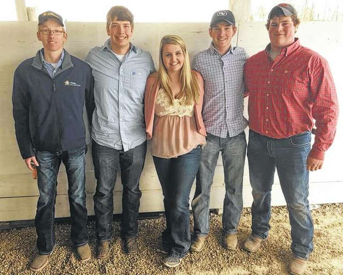 Jacksonville High School’s FFA chapter members placed first at the recent Section Livestock Judging Contest. They also placed first in Cattle Fitting. Team members include Dillon White (top photo, from left), Chase Tomhave, Jenna Wheeler, Lukas Hadden and Austin Dufelmeier.