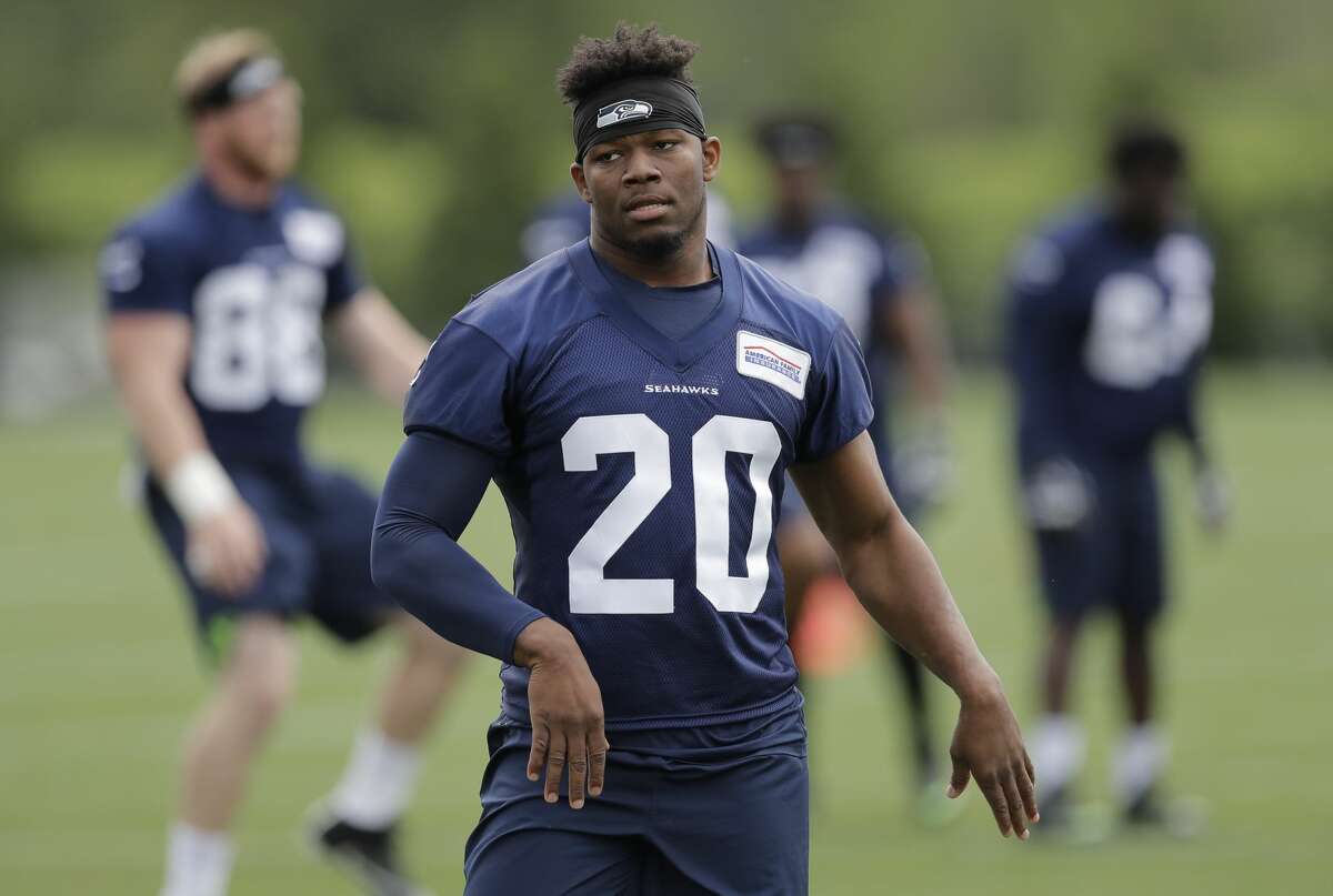 Seattle Seahawks running back Rashaad Penny stands on the field Friday, May 4, 2018, during NFL football rookie camp in Renton, Wash. (AP Photo/Ted S. Warren)