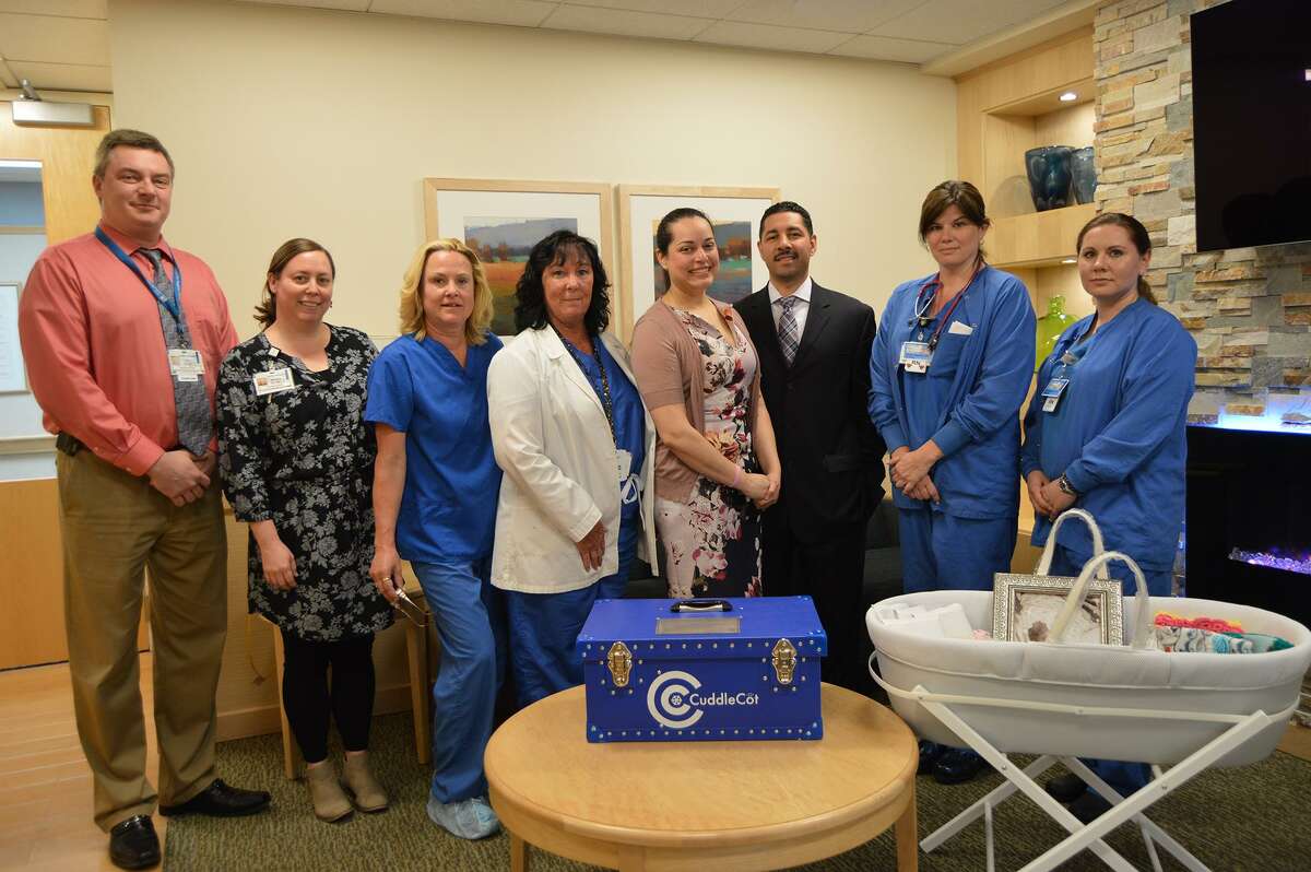 Jessica and Matthew Ocasio, of Annabella?’s Angels, present a donation of a CuddleCot at the Childbirth Center at Griffin Hospital. Pictured from left are Griffin Hospital Spiritual Care Chaplin Eric Gramse, Melanie O?’Leary, Griffin Development Fund Systems Coordinator, Naomi Gurdak, OB tech, Marge Fischer, RNC, MSN, Childbirth Center Clinical Director, Jessica and Matthew Ocasio, Kristen Richards, RN, and Gen Mayhew, RN.