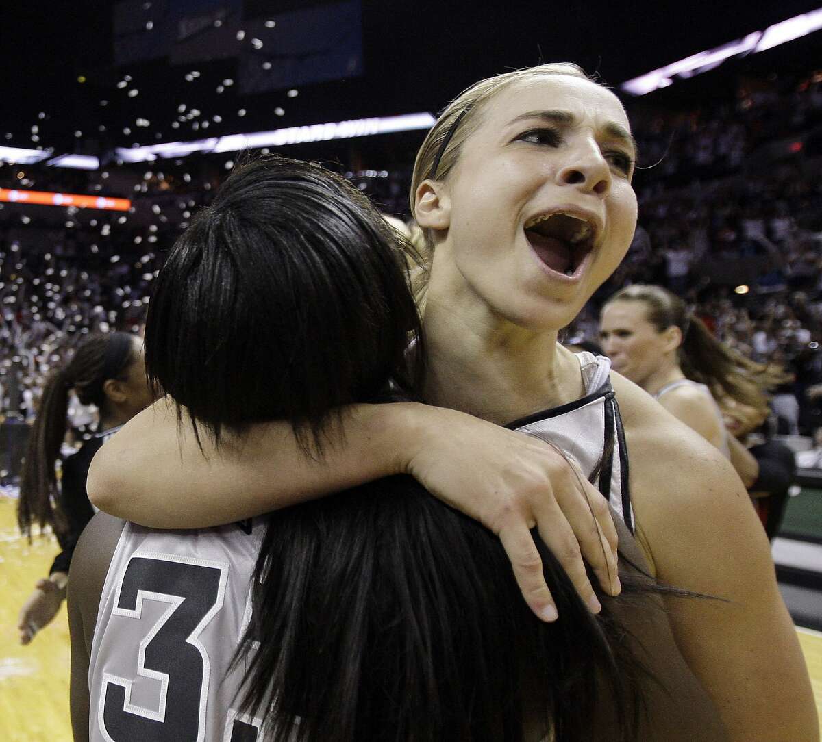San Antonio Silver Stars' Becky Hammon, right, and Vickie Johnson, left, celebrate after defeating the Los Angeles Sparks to win game 3 of the WNBA Western Conference Finals basketball game in San Antonio, Sunday, Sept. 28, 2008. San Antonio won 76-72 and will advance to the WNBA finals. (AP Photo/Eric Gay)