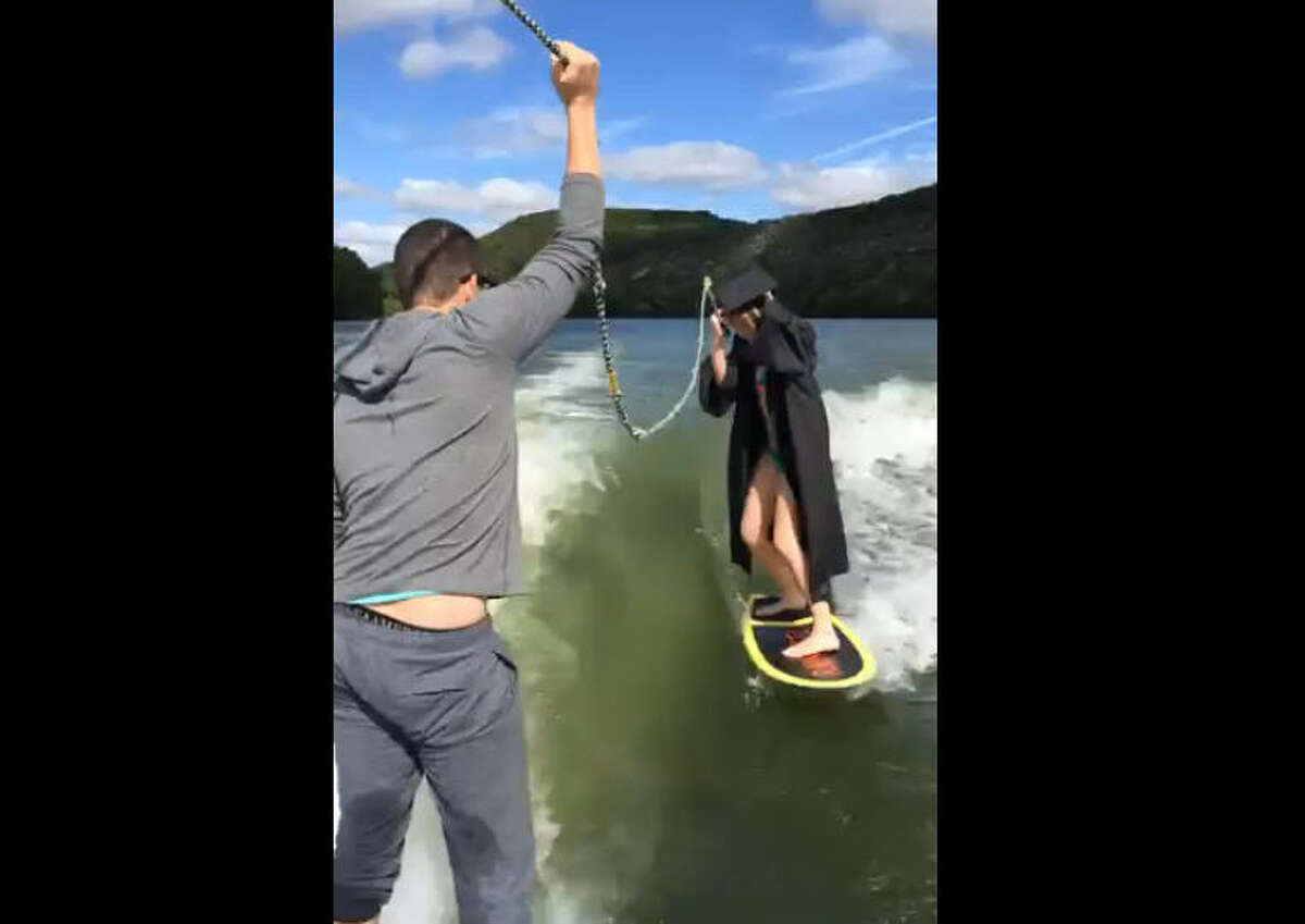 UT Austin student catches a wave, poses on wakeboard for senior pictures